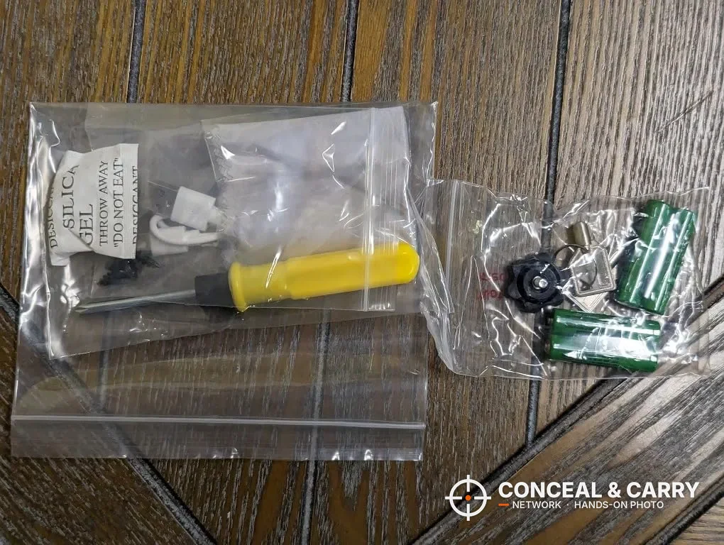 HOLEWOR drop-down safe hardware bags with screwdriver, screws, silica gel and batteries