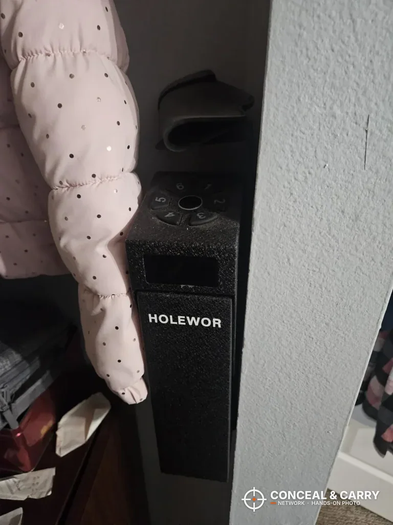 HOLEWOR drop-down safe mounted beside a wall