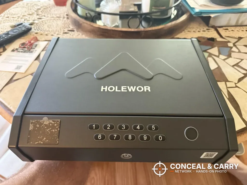 HOLEWOR handheld safe version with a ten-button keypad and a mountain logo on the lid