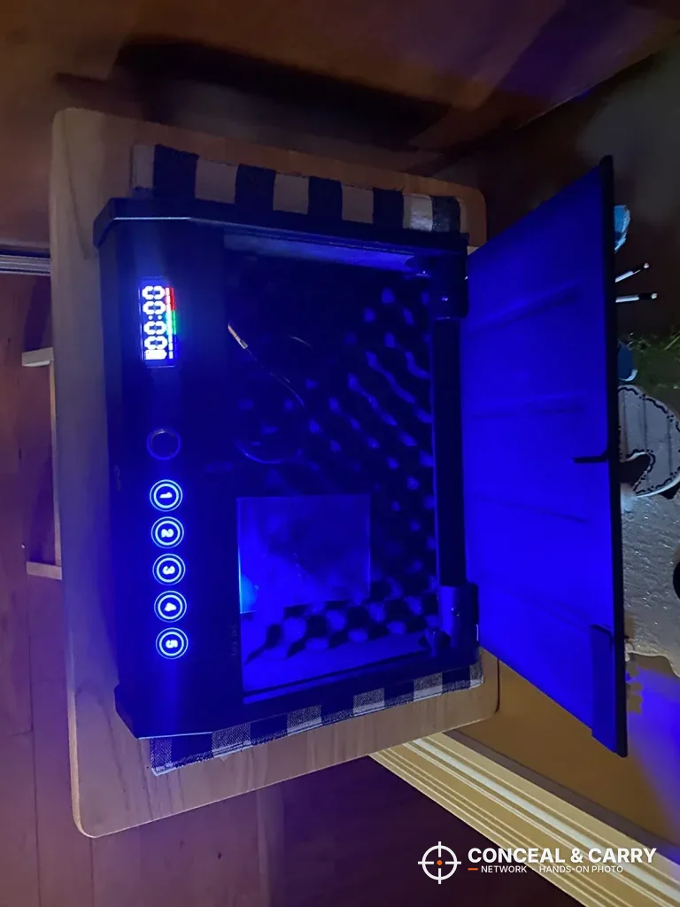 HOLEWOR handheld safe lid open in the dark with the blue interior light on