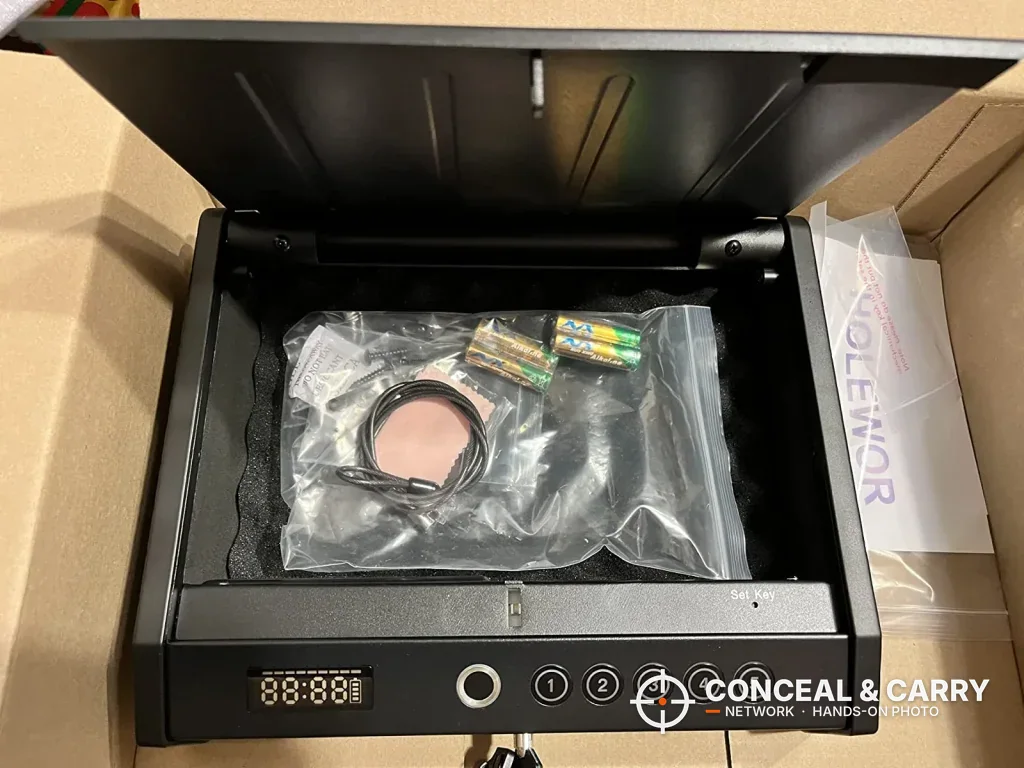 HOLEWOR handheld safe open in its shipping carton with the cable and batteries bagged inside