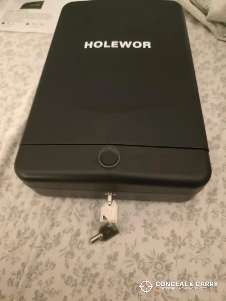 HOLEWOR lock box closed with the backup key in the lock below the fingerprint reader