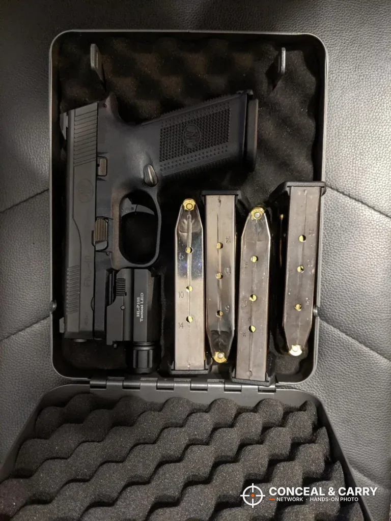 Hornady Lockbox open with a pistol and several spare magazines
