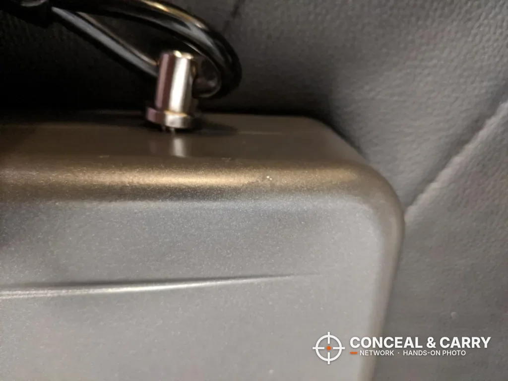 Hornady Lockbox cable end at the edge of the closed box