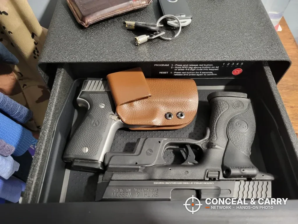 Hornady Night Guard drawer holding two handguns, one in a tan leather holster