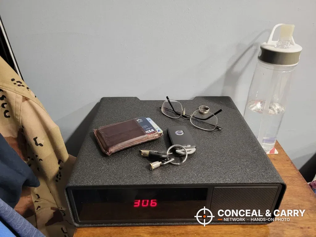 Hornady Night Guard closed on a dresser with a wallet, glasses and keys on top