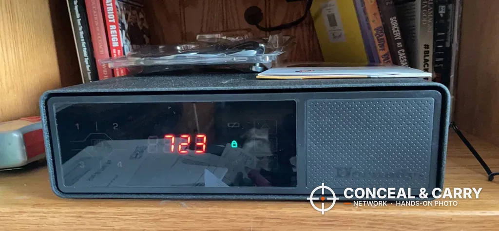 Front glass panel of the Hornady Night Guard showing the red clock and the Hornady name