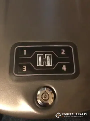 Close-up of the Hornady RAPiD Safe RFID lid panel with buttons 1 to 4 and the key lock