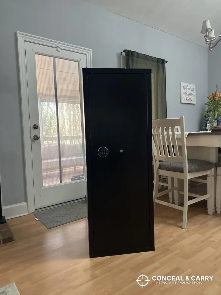 INTERGREAT long gun cabinet standing closed in a dining room