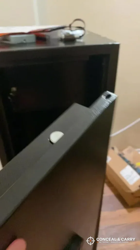 Edge of the INTERGREAT gun cabinet door swung open