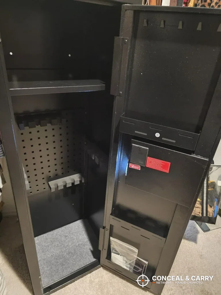 KAER 12-15 gun cabinet open with a top shelf, pegboard, floor rack and door storage