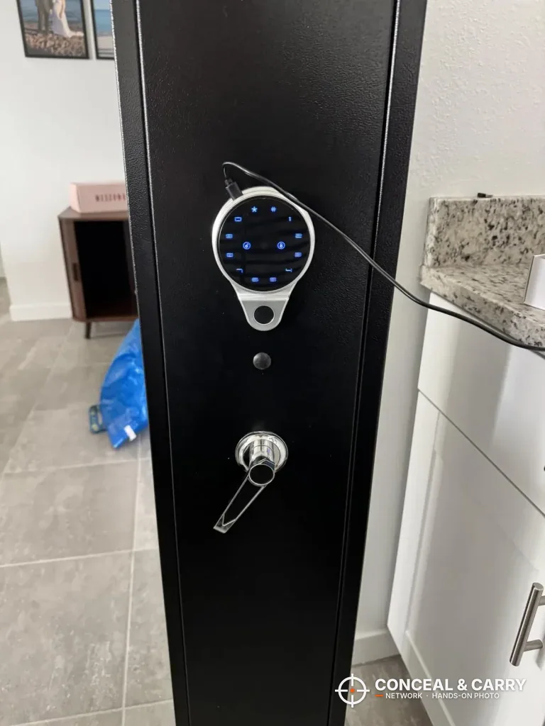 KAER 12-15 gun cabinet with a round keypad lit blue above a lever handle