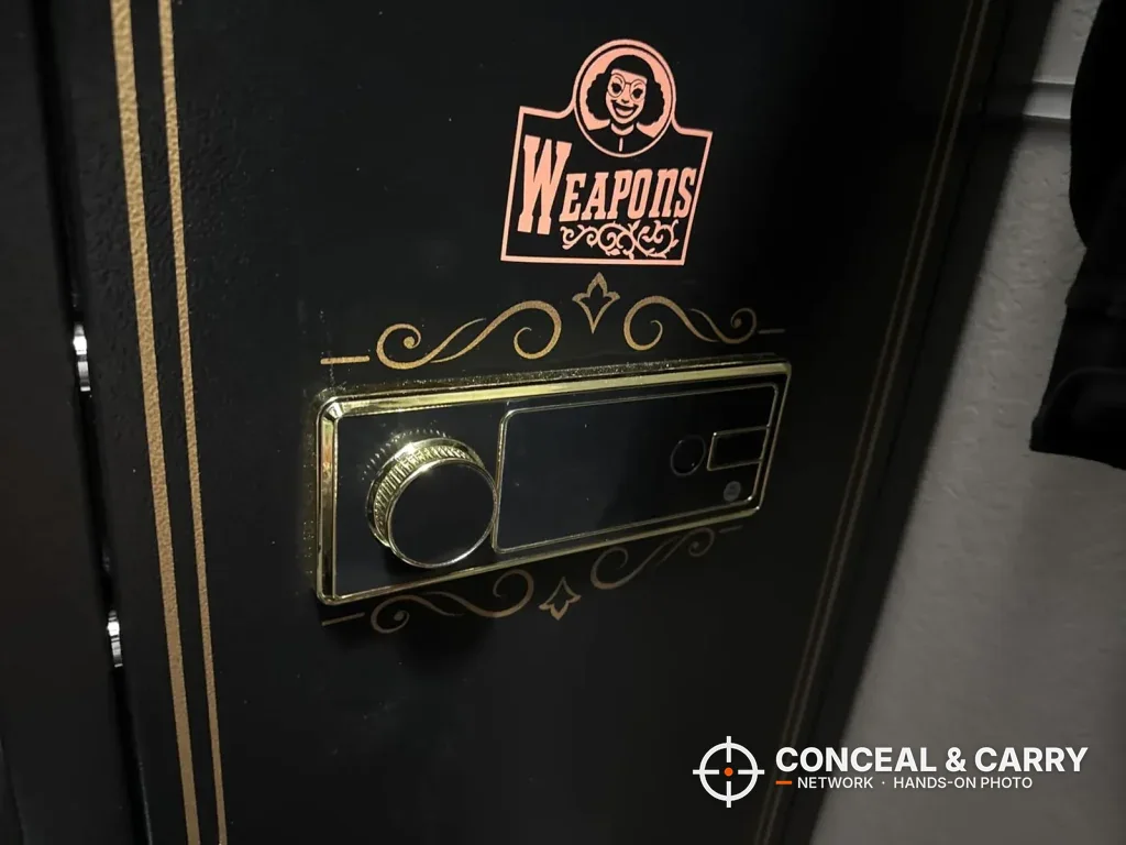 Close-up of the gold-trimmed lock panel on a KAER 12-15 gun cabinet