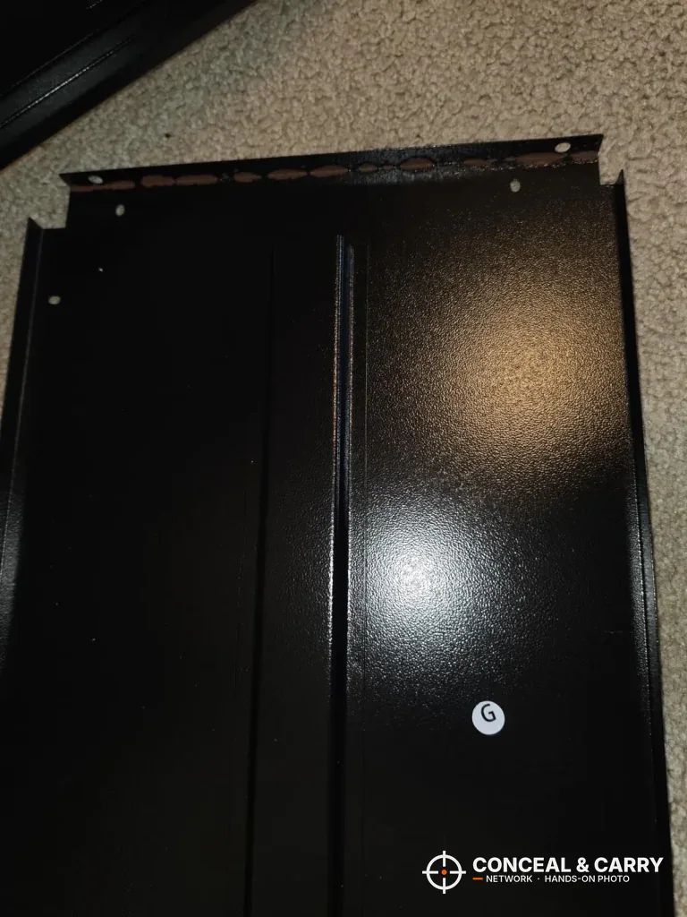 KAER 12-15 gun cabinet lying flat on the carpet