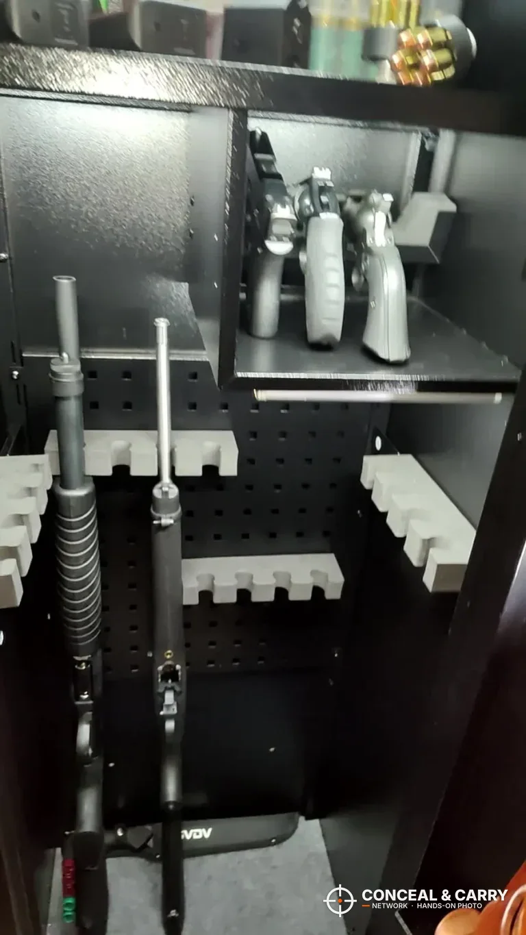 KAER 13-16 gun safe interior with rifles in the racks and handguns on the upper shelf