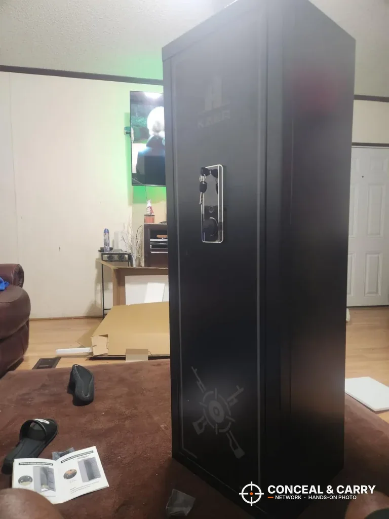 KAER 13-16 gun safe standing closed with the manual and parts on the floor