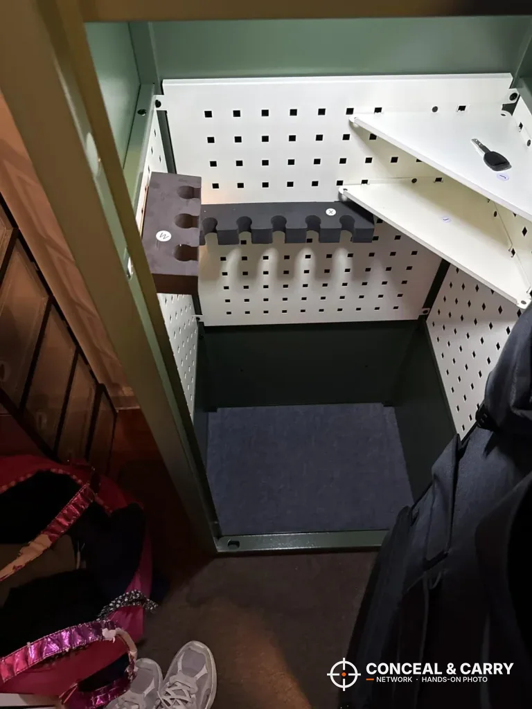 Inside the KAER 18-21 gun safe with a perforated panel, a shelf and a floor mat