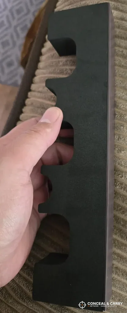 Hand holding a KAER 18-21 gun safe foam rack piece