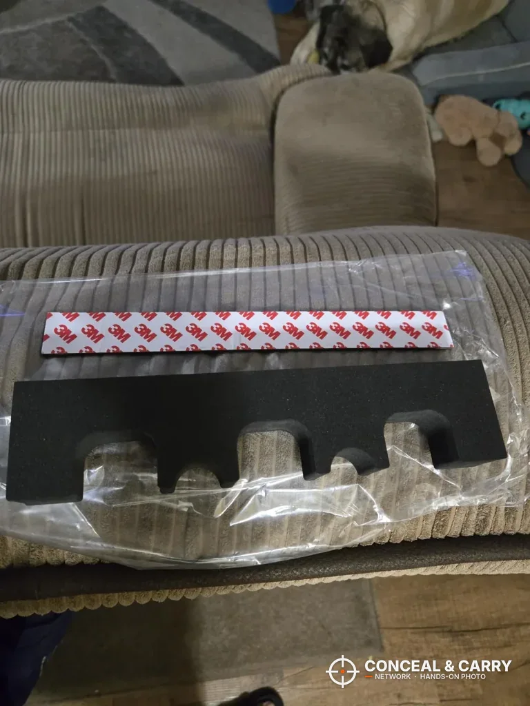 KAER 18-21 foam rack still wrapped in plastic on a couch