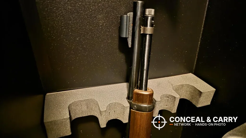 Wood-stocked rifle seated in the KAER 18-21 gun safe foam rack