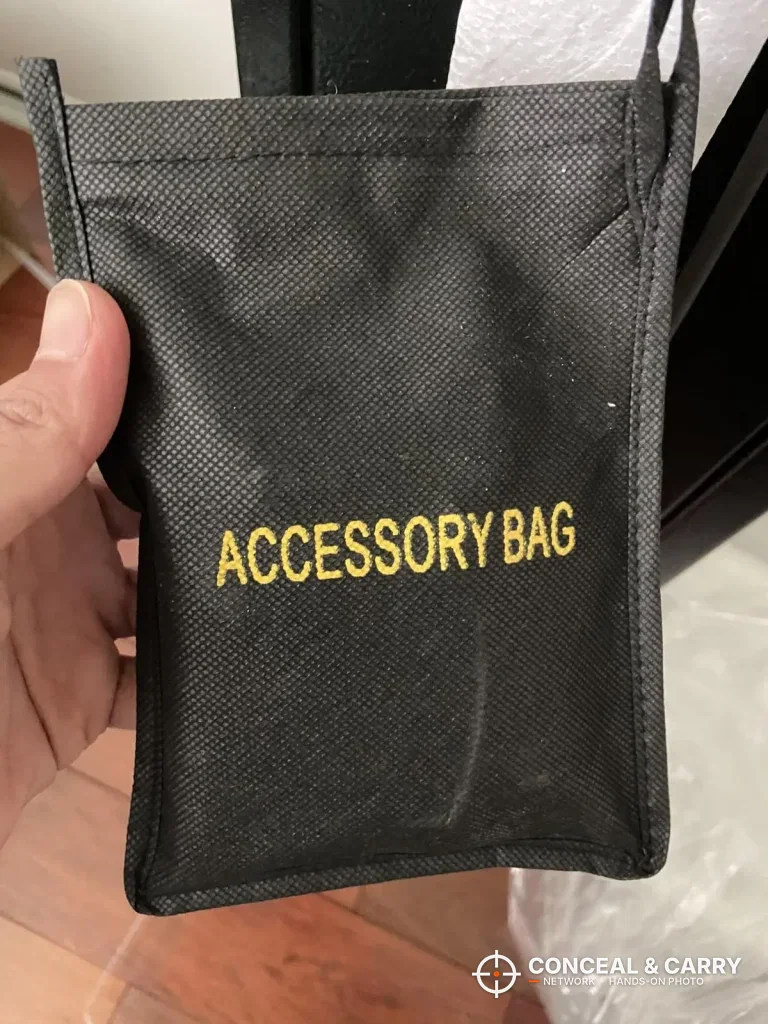KAER 2-3 gun rifle safe accessory bag held in hand