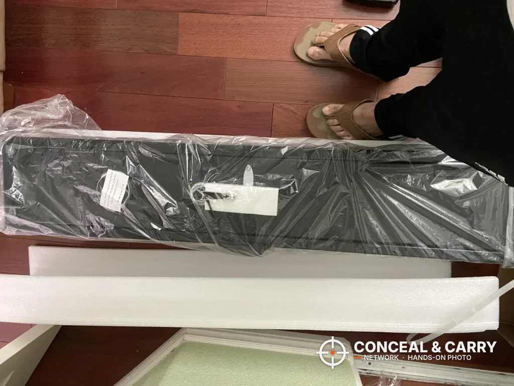 KAER 2-3 gun rifle safe wrapped in plastic on the floor with foam packing