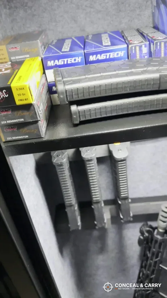 Shelf in the KAER 3-gun rifle safe holding ammunition boxes and magazines