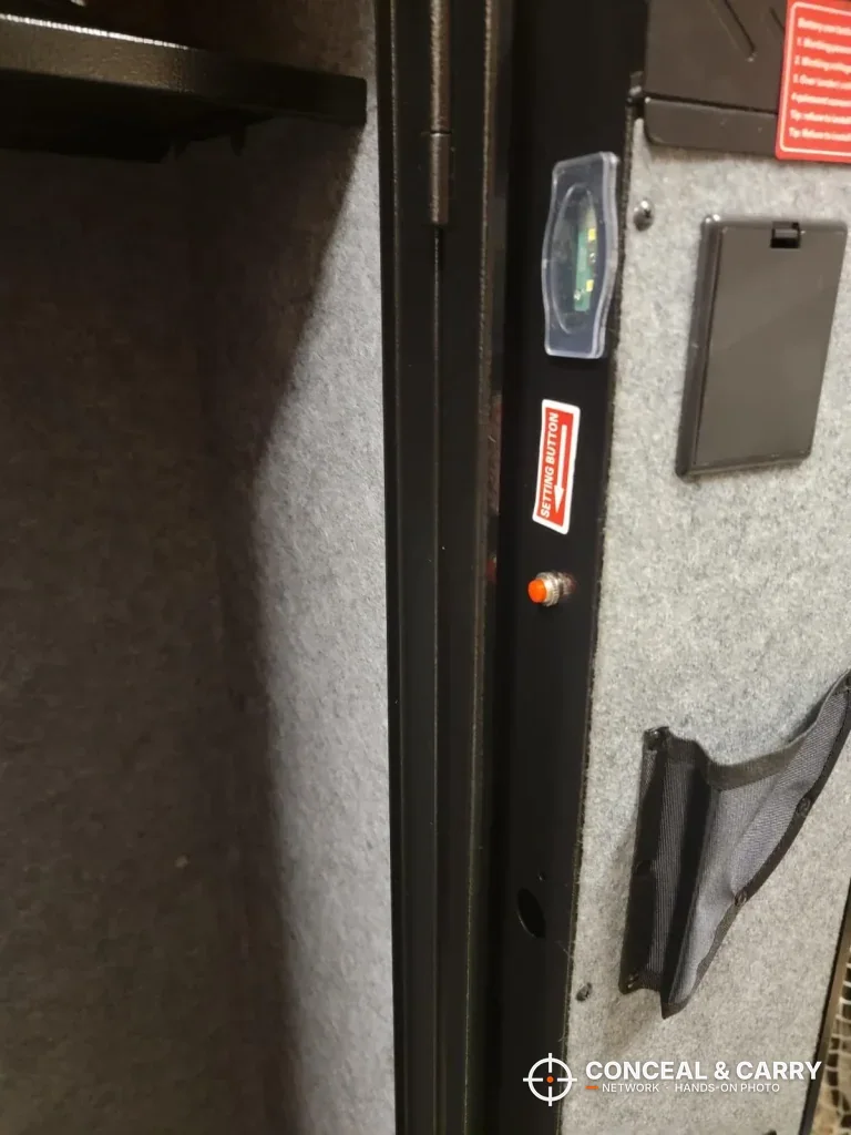 Close-up of the KAER 3-gun rifle safe door frame, sensor light and door-back felt