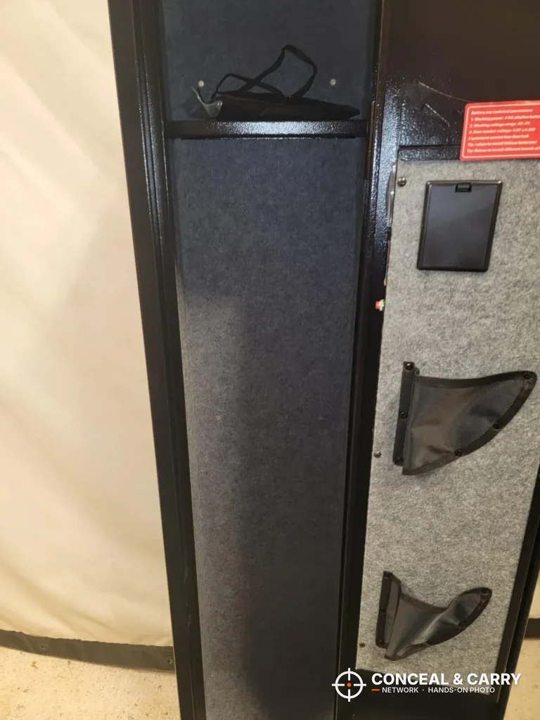 Empty KAER 3-gun rifle safe with a felt-lined door and pistol pockets