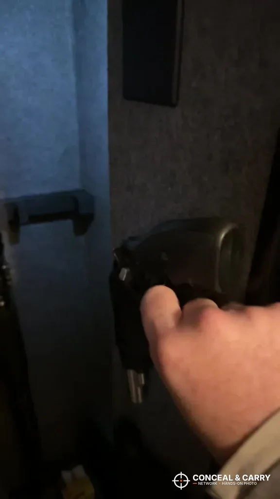 Hand reaching into the open KAER 4-5 gun biometric rifle safe