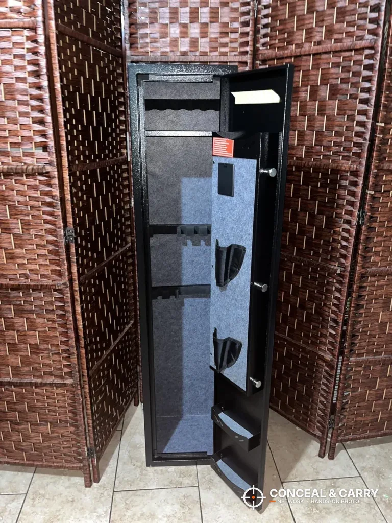 KAER 4-5 gun biometric rifle safe open and empty in front of a room divider
