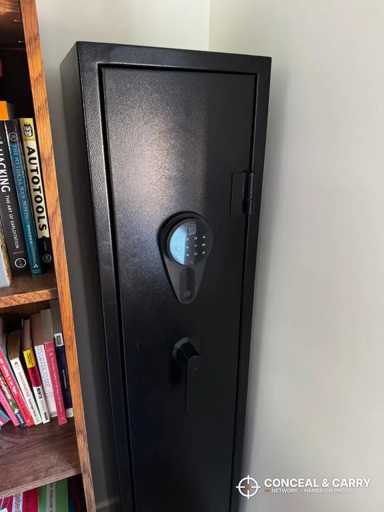 KAER 4-5 gun biometric rifle safe closed in a corner beside a bookshelf