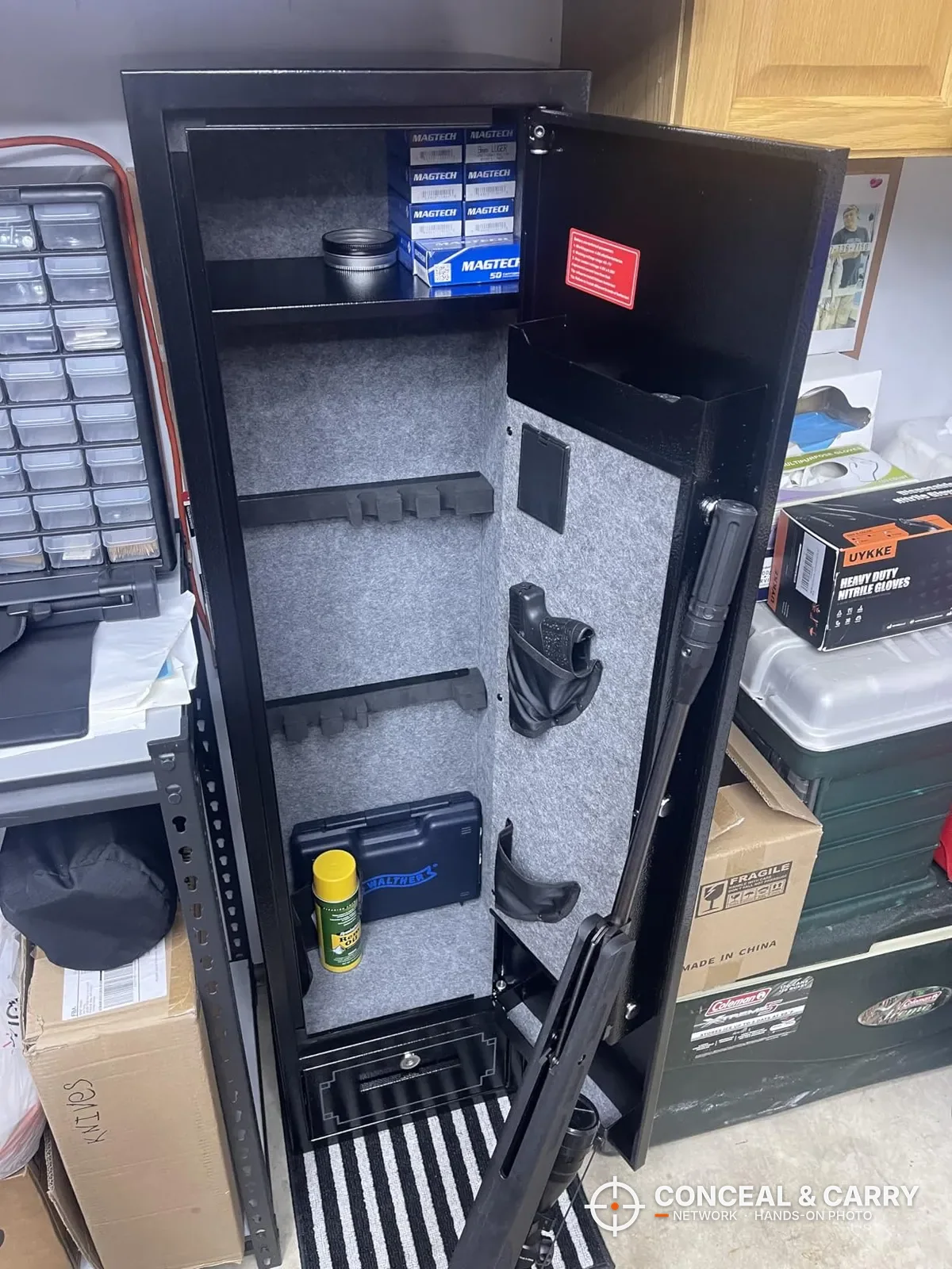 KAER 5-6 gun quick access safe open with ammunition on the top shelf and gear in the door pockets
