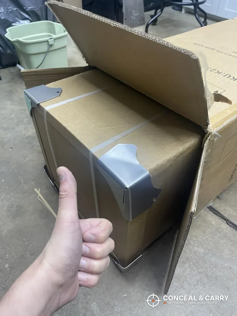 Opened KAER 5-6 gun safe shipping box with corner protectors in place
