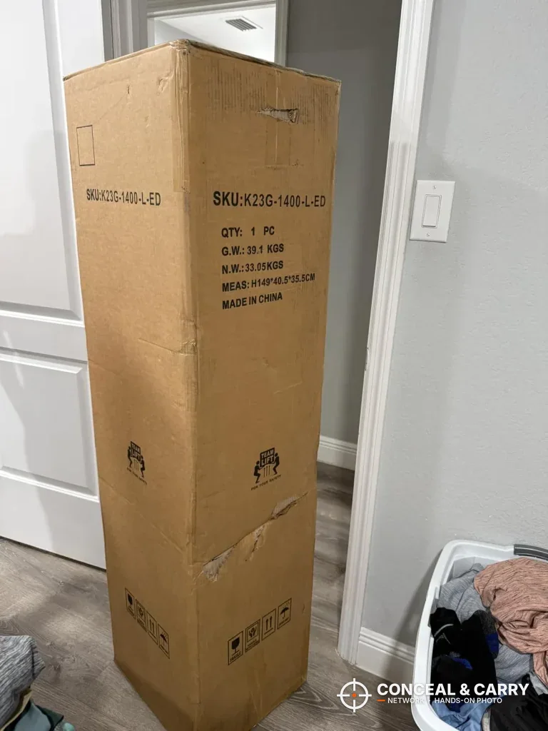 KAER 5-6 gun quick access safe shipping box standing upright in a hallway