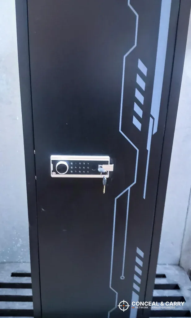 KAER 8-12 gun cabinet closed on a pallet, with the keypad and gray line graphics