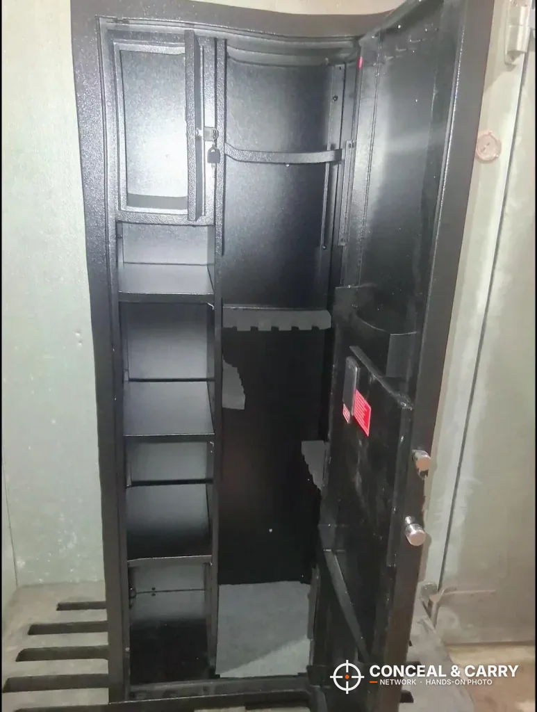 KAER 8-12 cabinet open and empty on a pallet, with hardware on the door edge