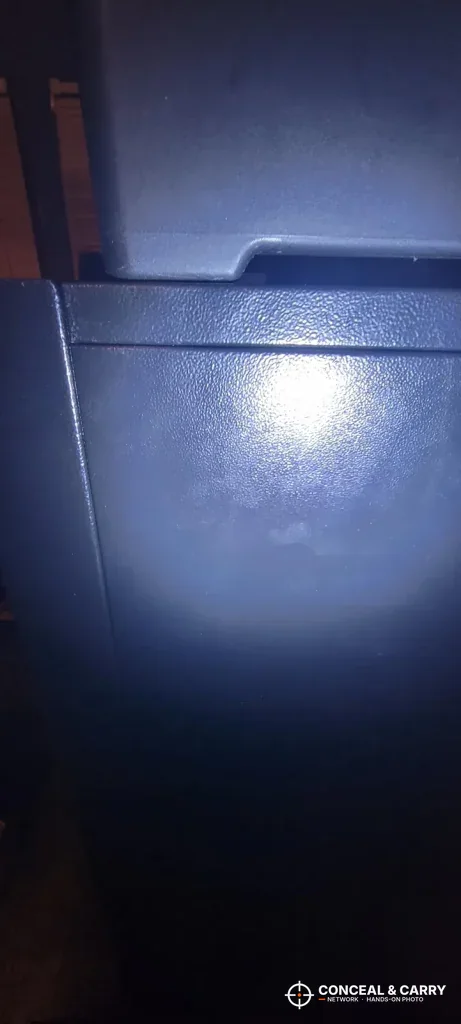 Flashlight on the top edge of the KAER 8-12 cabinet door