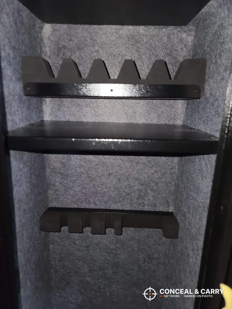 Notched barrel rest above the shelf and a lower rack inside the KAER long gun safe