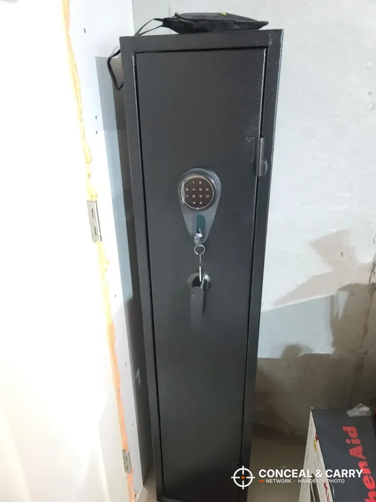 KAER electronic long gun safe closed in a room corner