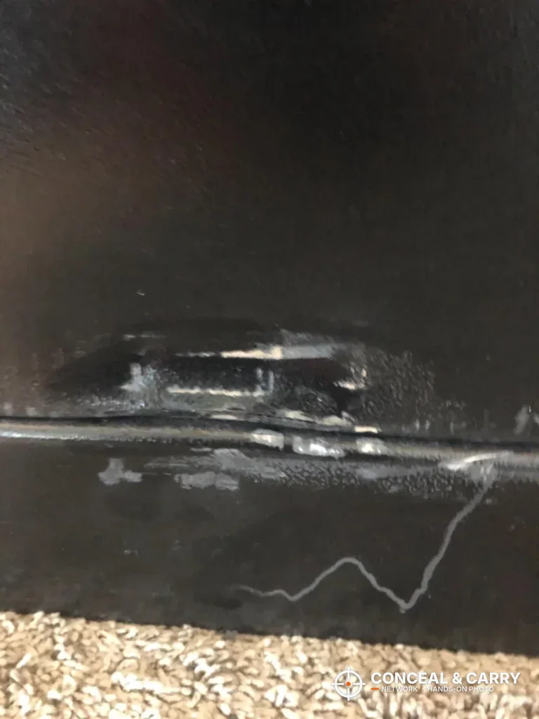 Dented and scraped steel along the bottom edge of the Kodiak KBX5629