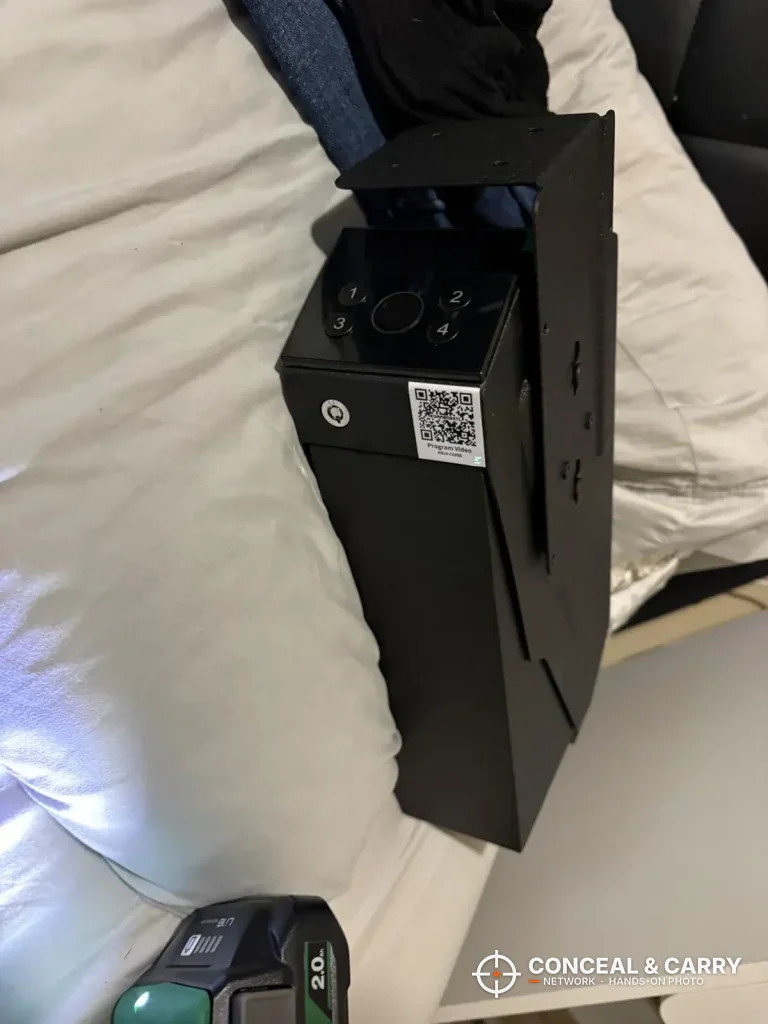 KornerBatl bedside safe lying on a bed showing the top controls