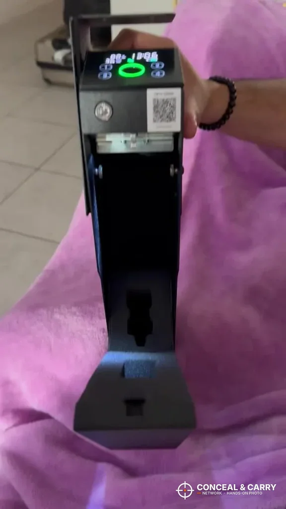 KornerBatl safe held up with the display lit and the drawer open