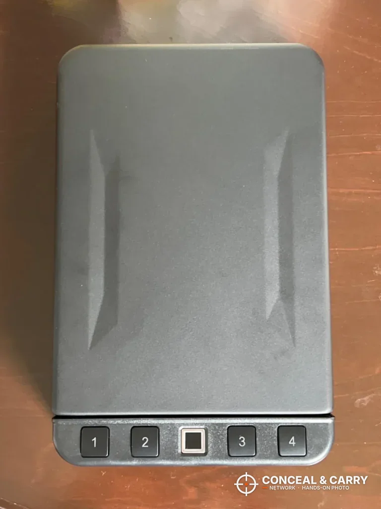 Langger lock box closed, top view with the four buttons and fingerprint pad