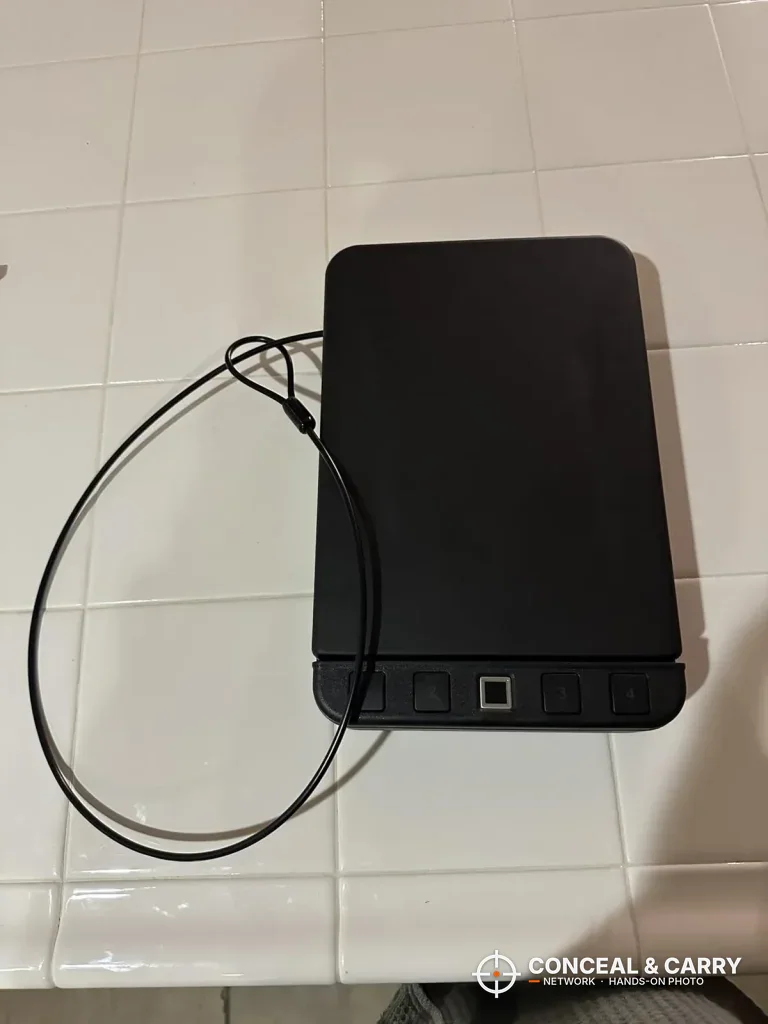 Langger lock box with its security cable looped on a counter