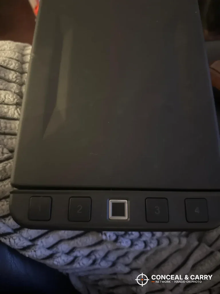 Close-up of the Langger lock box fingerprint pad between the keypad buttons