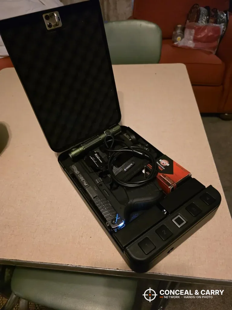 Langger lock box lid up on a table with gear inside