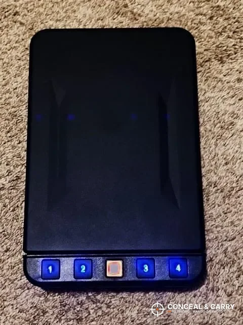 Langger lock box keypad backlit blue in a dark room