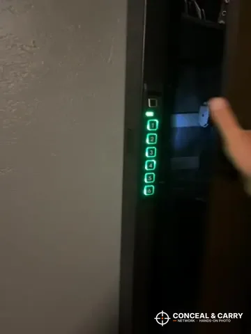 Langger compact safe keypad buttons lit green in low light
