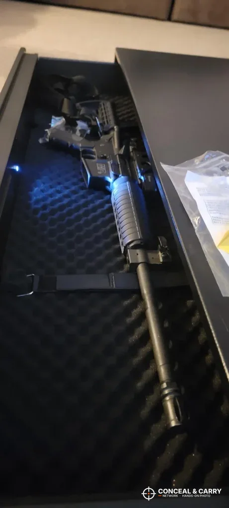 Rifle lying in the egg-crate foam inside the Langger under-bed safe drawer